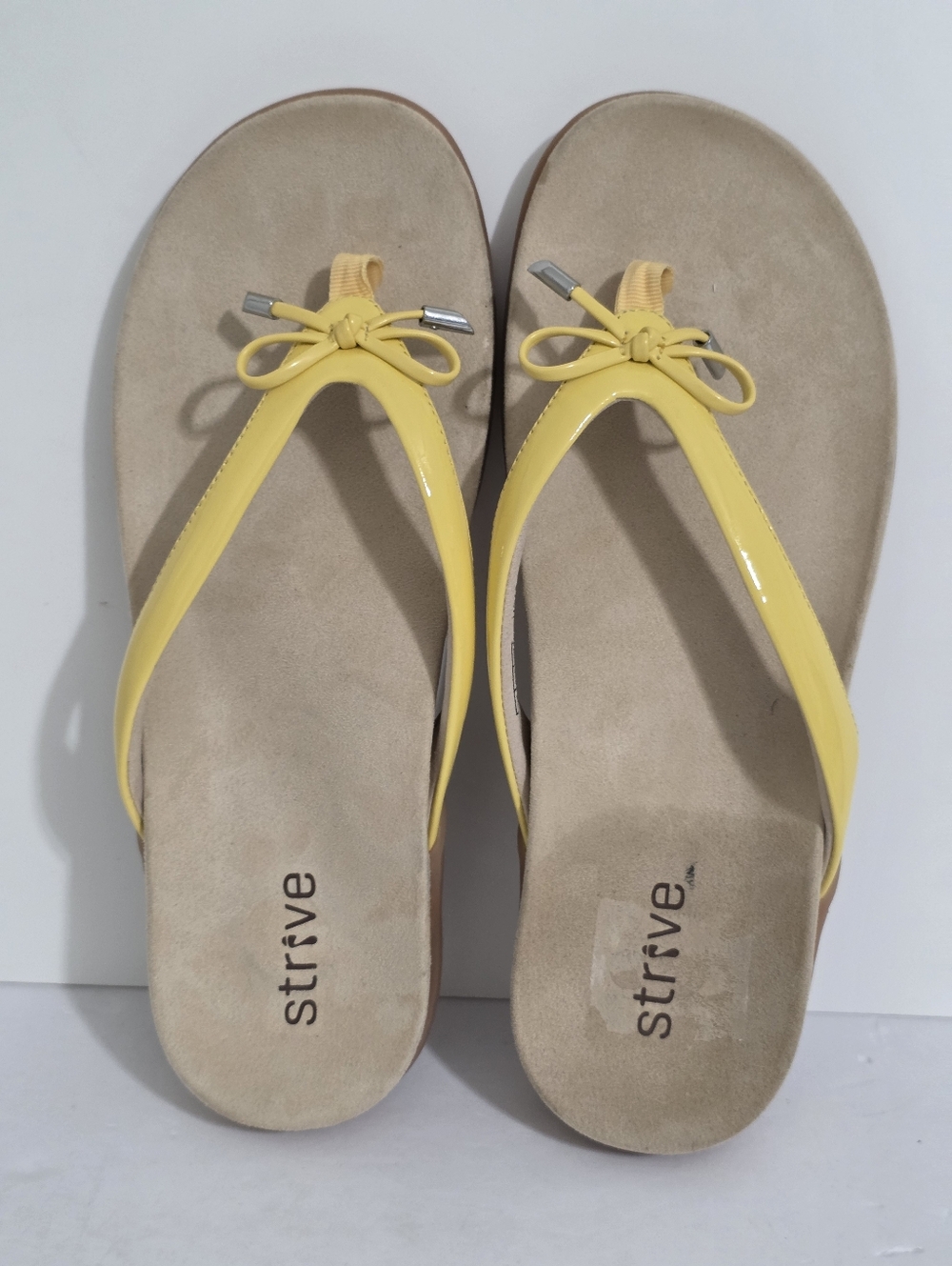 Strive Women's Yellow Patent Thong Sandals with Bow Accent